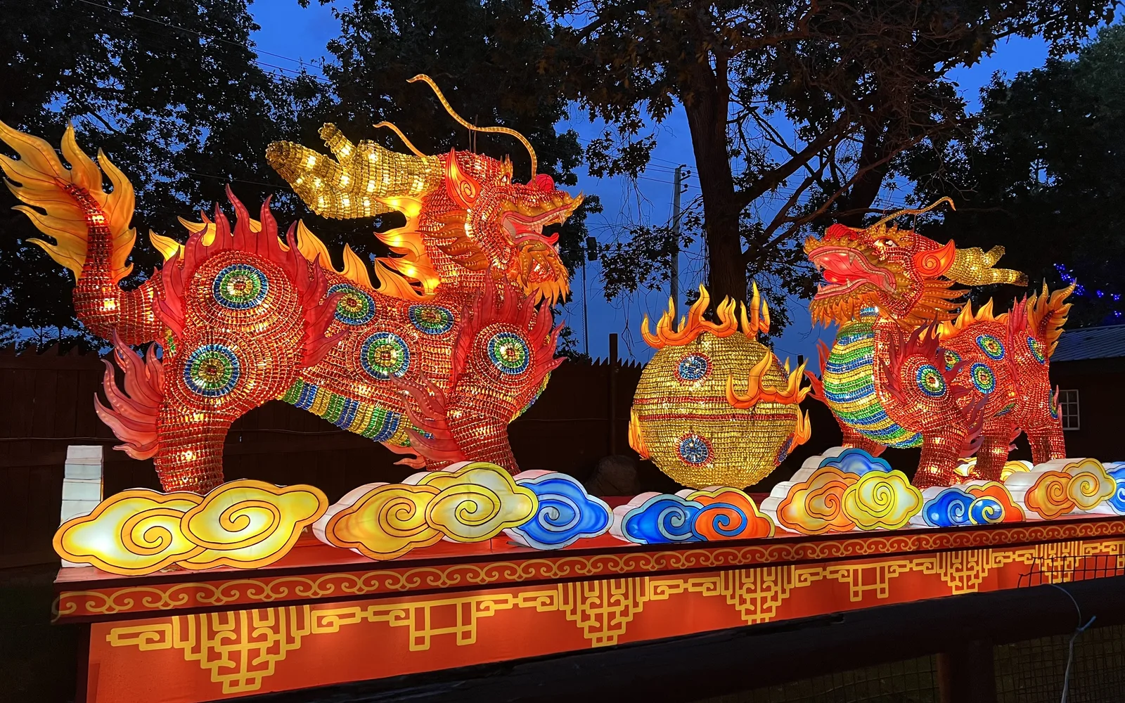 Illuminated lanterns in red and gold tones at a Chinese New Year celebration